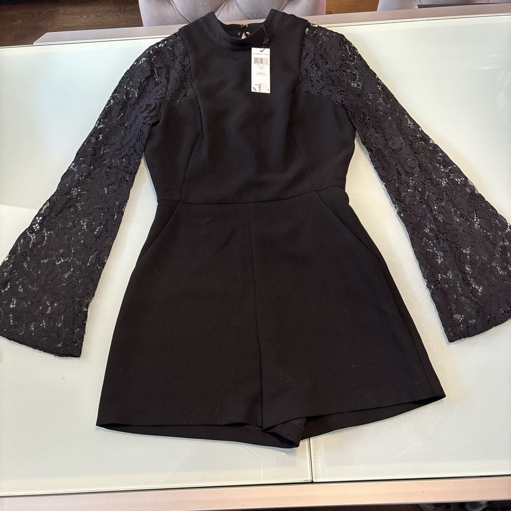 New with tags BCBG black lace romper 2.